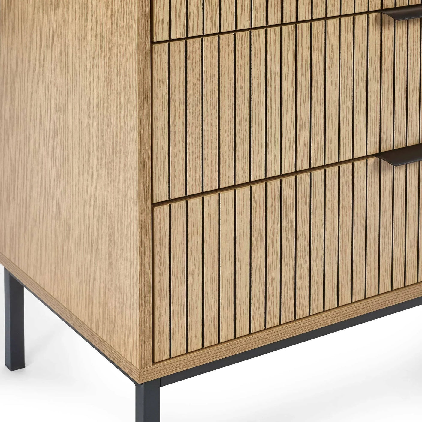 Oak wood chest of drawers with vertical groove detail and black metal legs