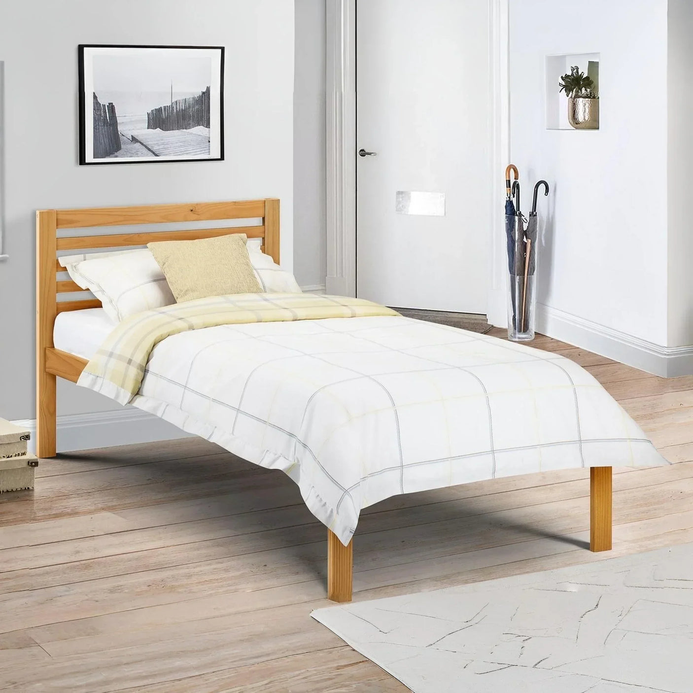 single wooden bed frame with white checked bedding in modern bedroom