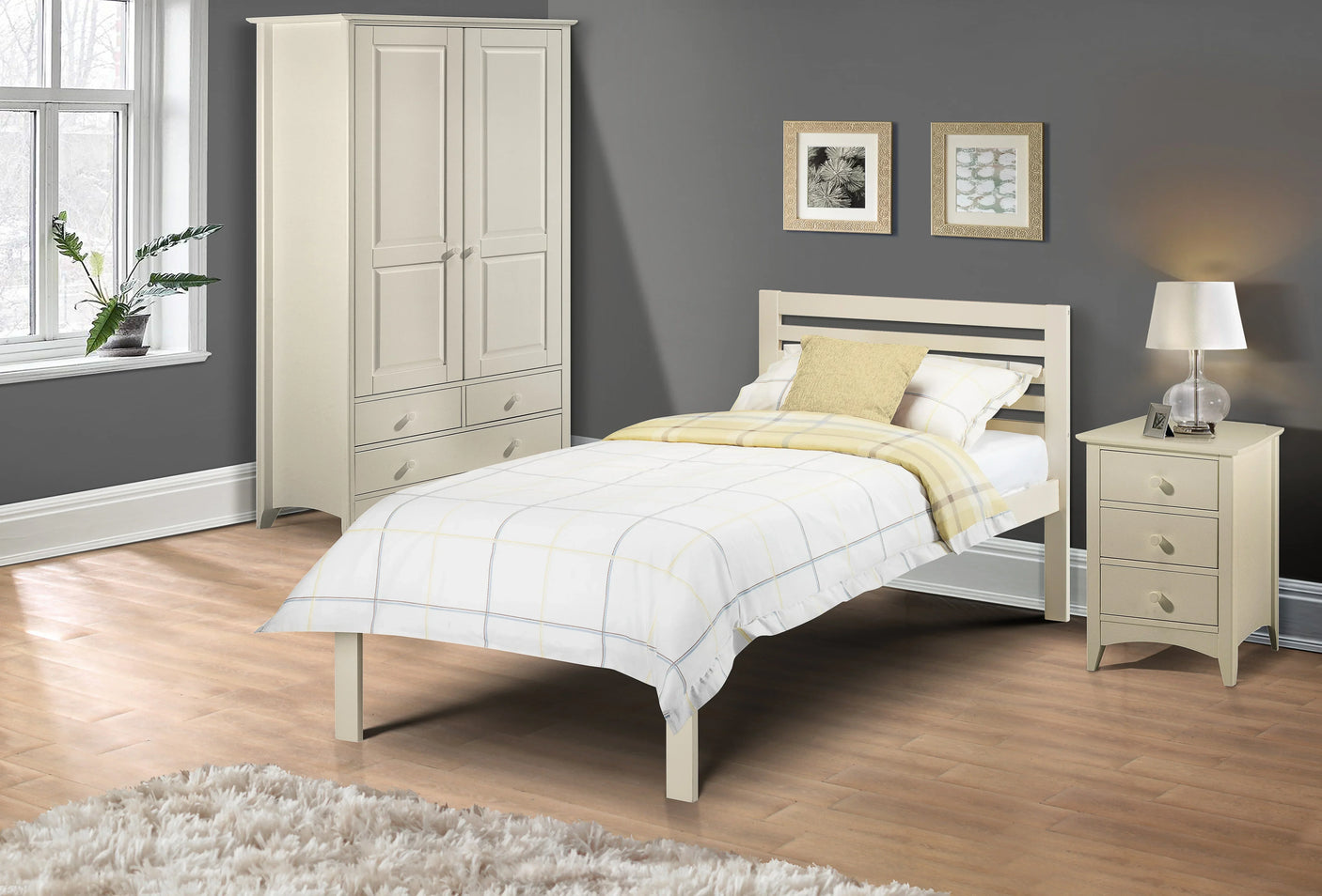 White single bed with headboard, matching wardrobe and nightstand in modern bedroom