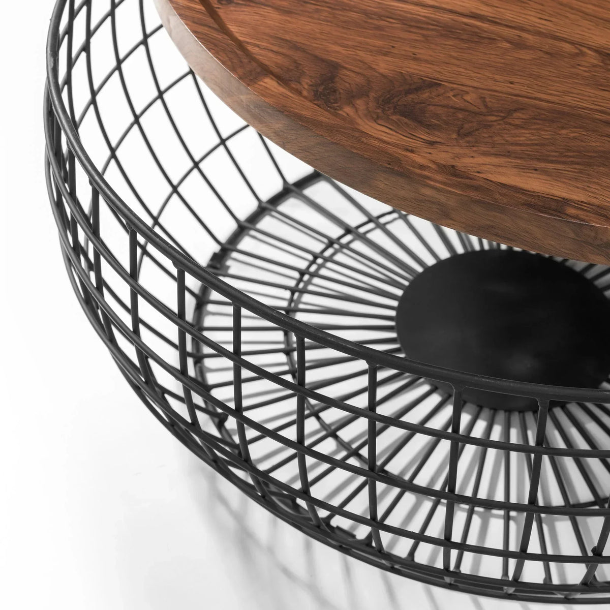 Round coffee table with black wire metal base and wooden top, close-up angle