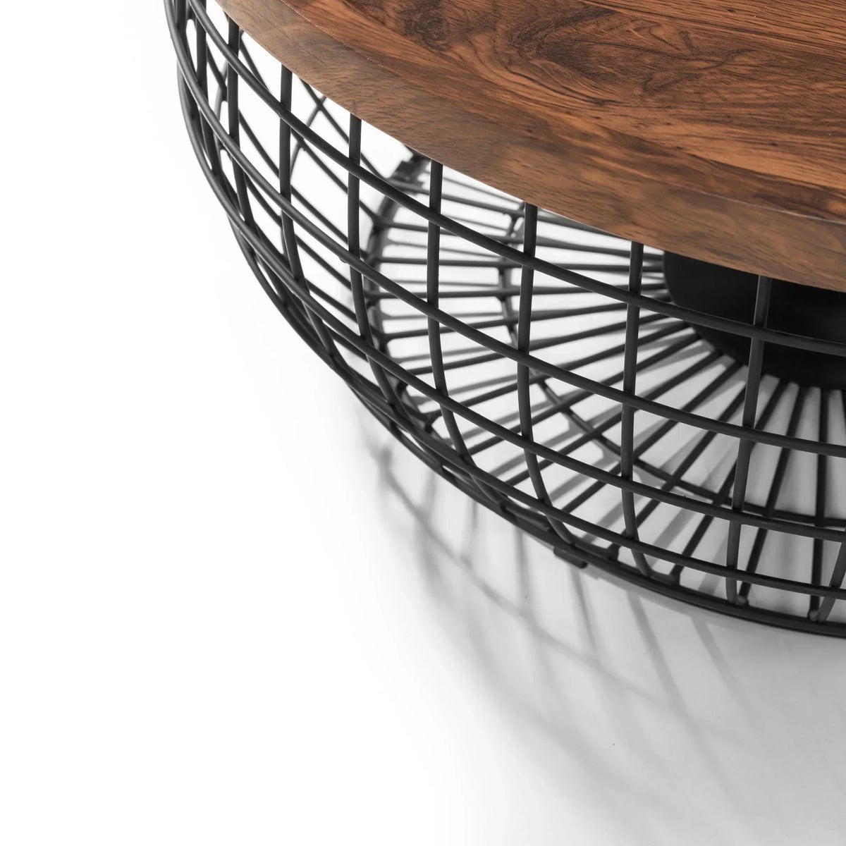 Round coffee table with wooden top and black metal wire base, close-up angle