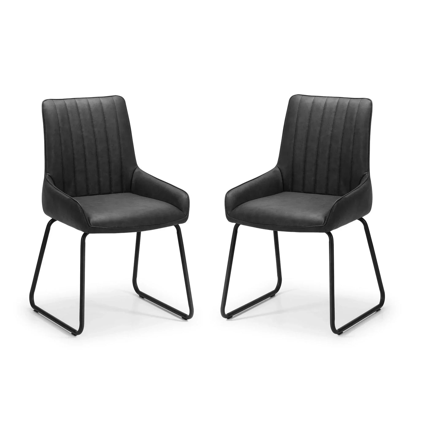 Pair of black antique dining chairs with metal legs and stitched upholstered seats