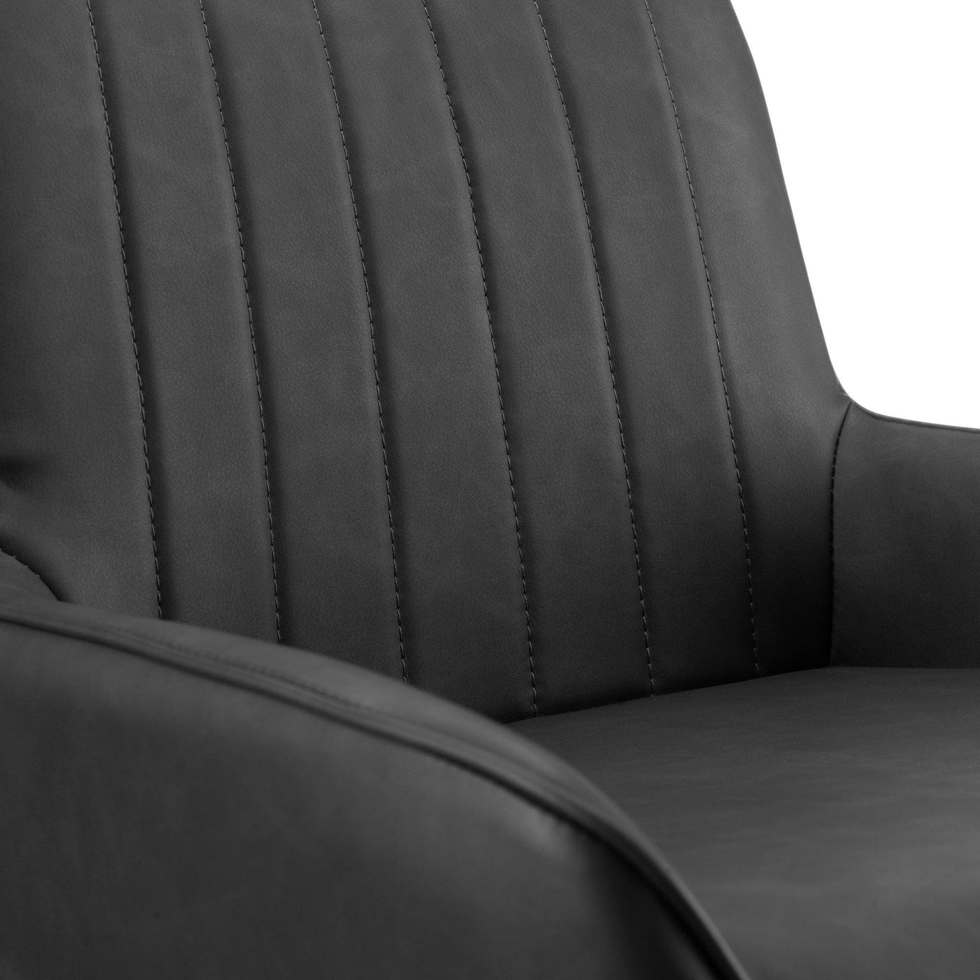 Closeup of black leather dining chair with vertical stitched detailing on backrest