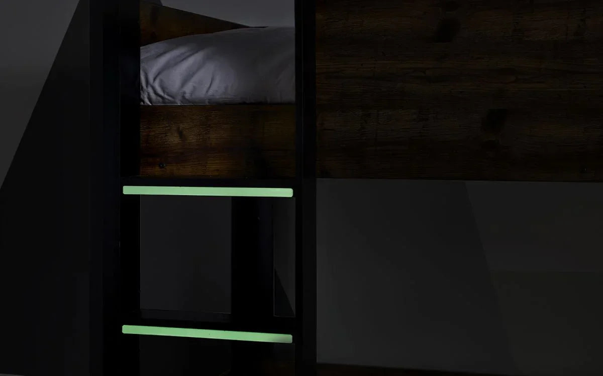Wooden bunk bed with glow in the dark ladder steps and dark finish