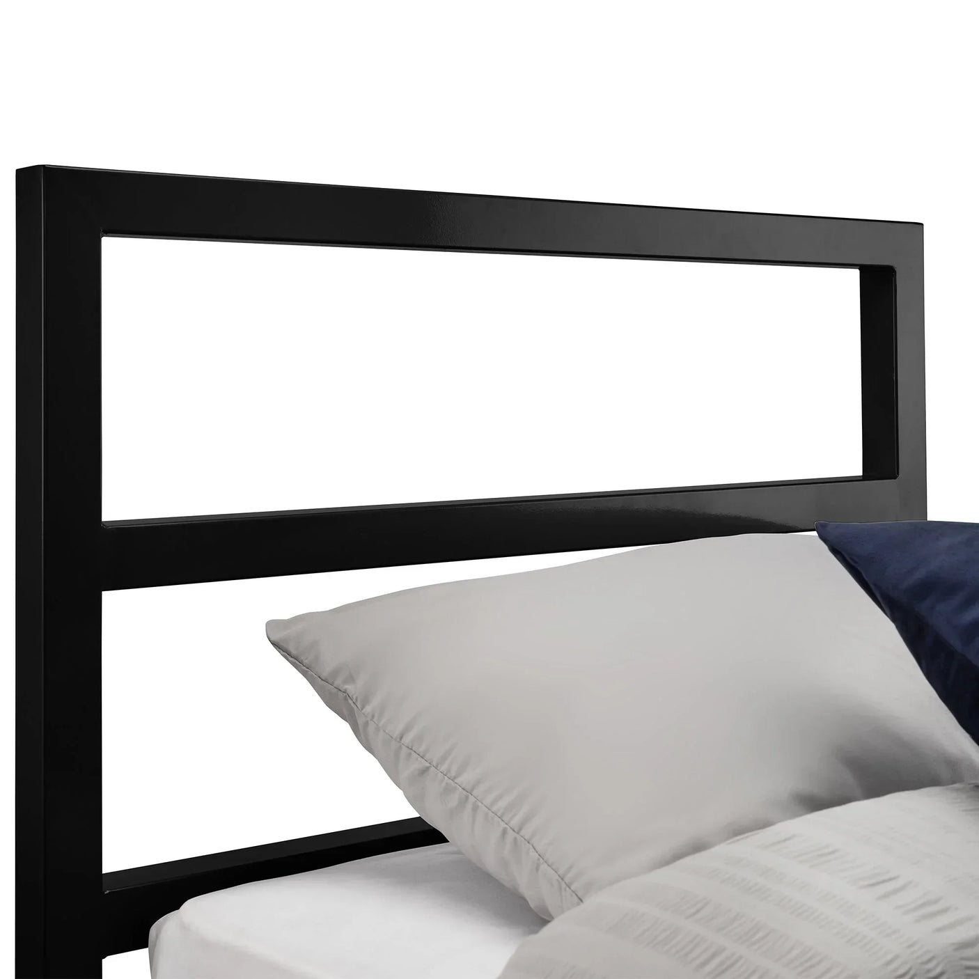 Black metal bed frame headboard with grey and navy pillows
