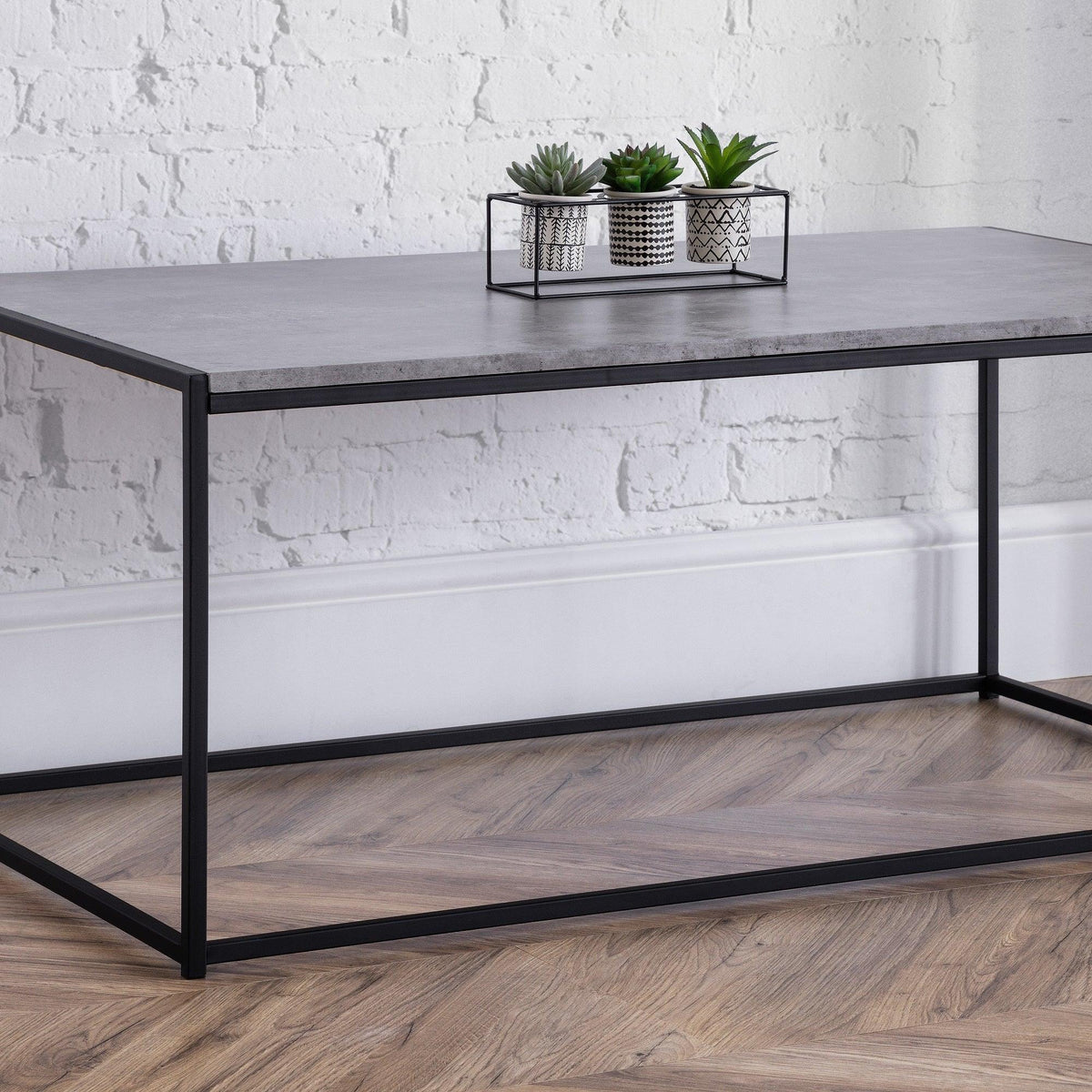 Staten coffee table with concrete effect top and black metal frame in modern living room