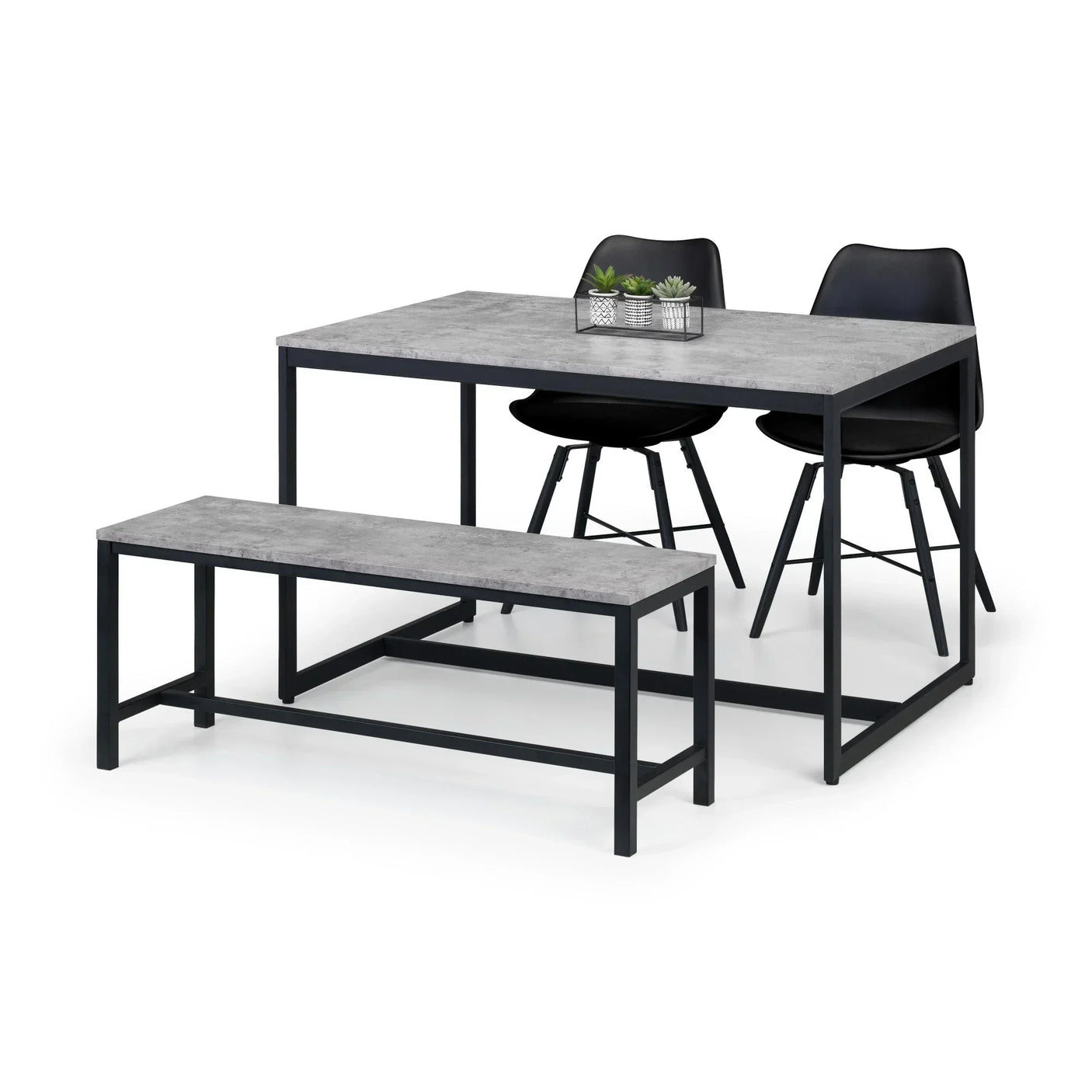 Concrete effect dining table set with black metal frame, bench, two black chairs, and plant decor