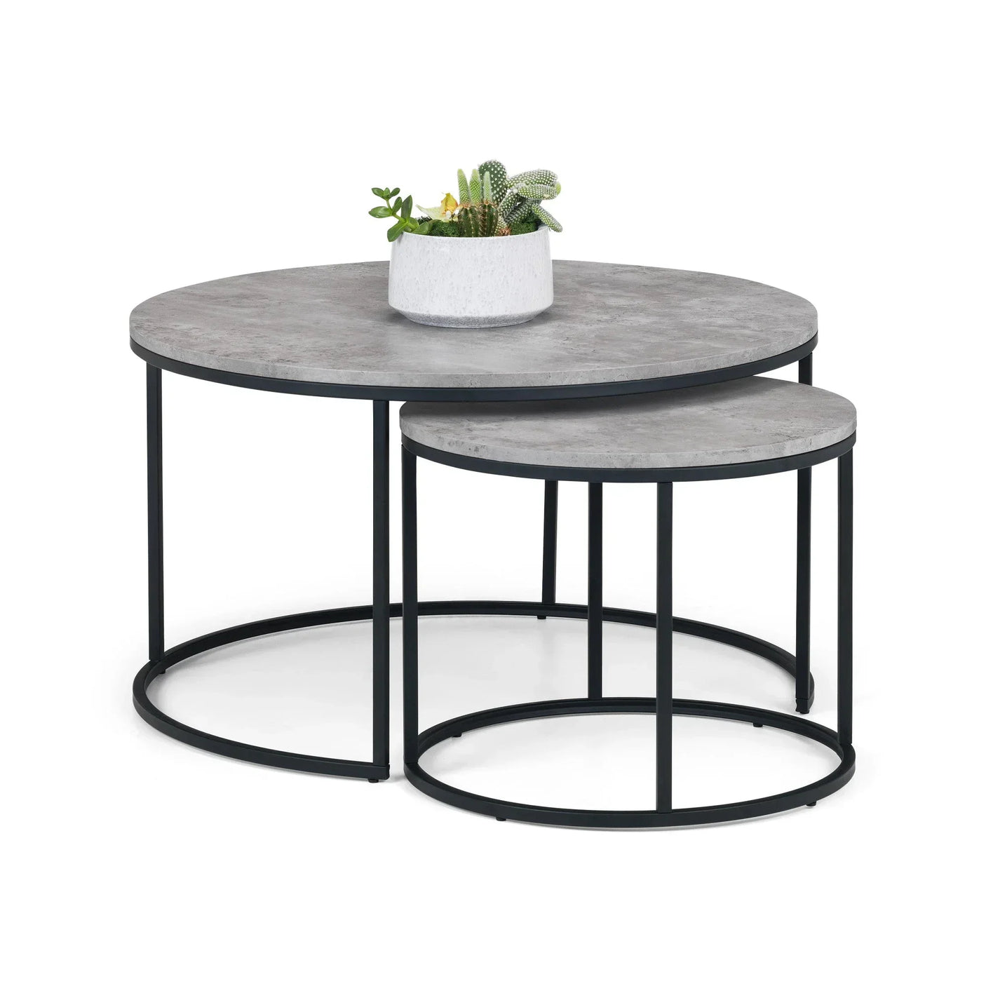Round nesting coffee tables with concrete-effect tops and black metal frames, plant decor on top