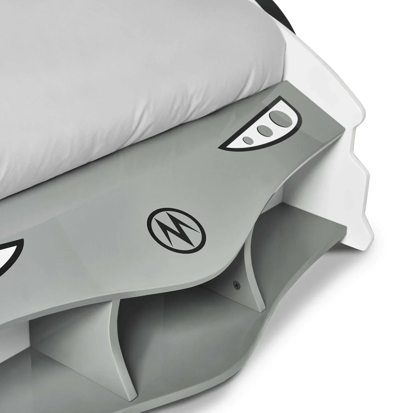 Grey and white kids bed with car front panel, shelf storage, and printed details