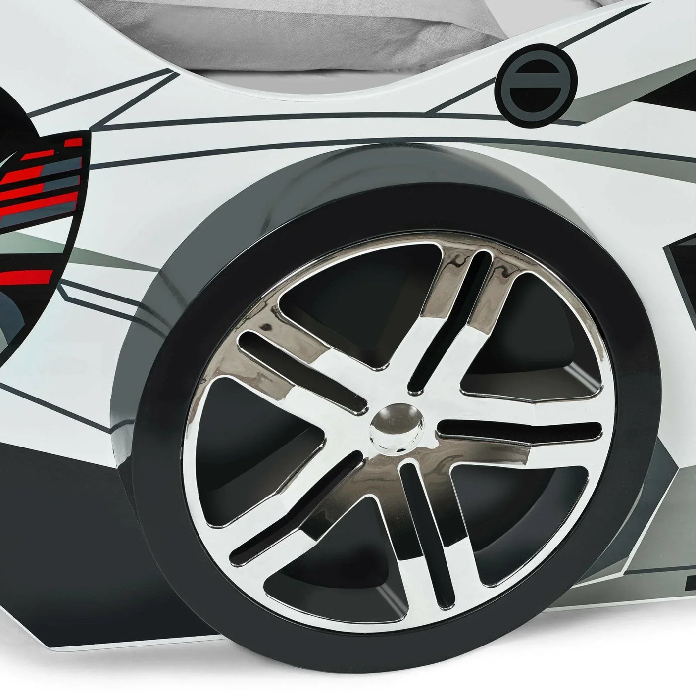 Closeup of car bed chrome wheel detail with black and white finish