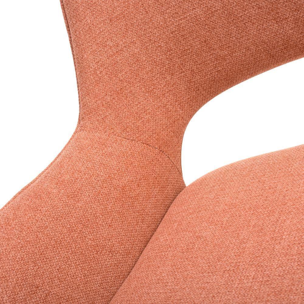 Close-up of textured orange upholstered chair back and seat