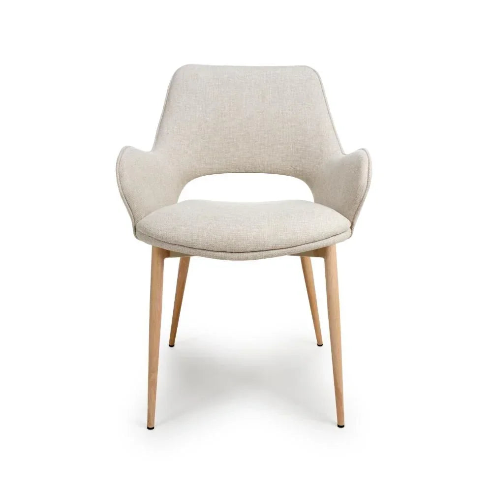 Beige fabric dining chair with curved backrest and wooden legs, front angle view