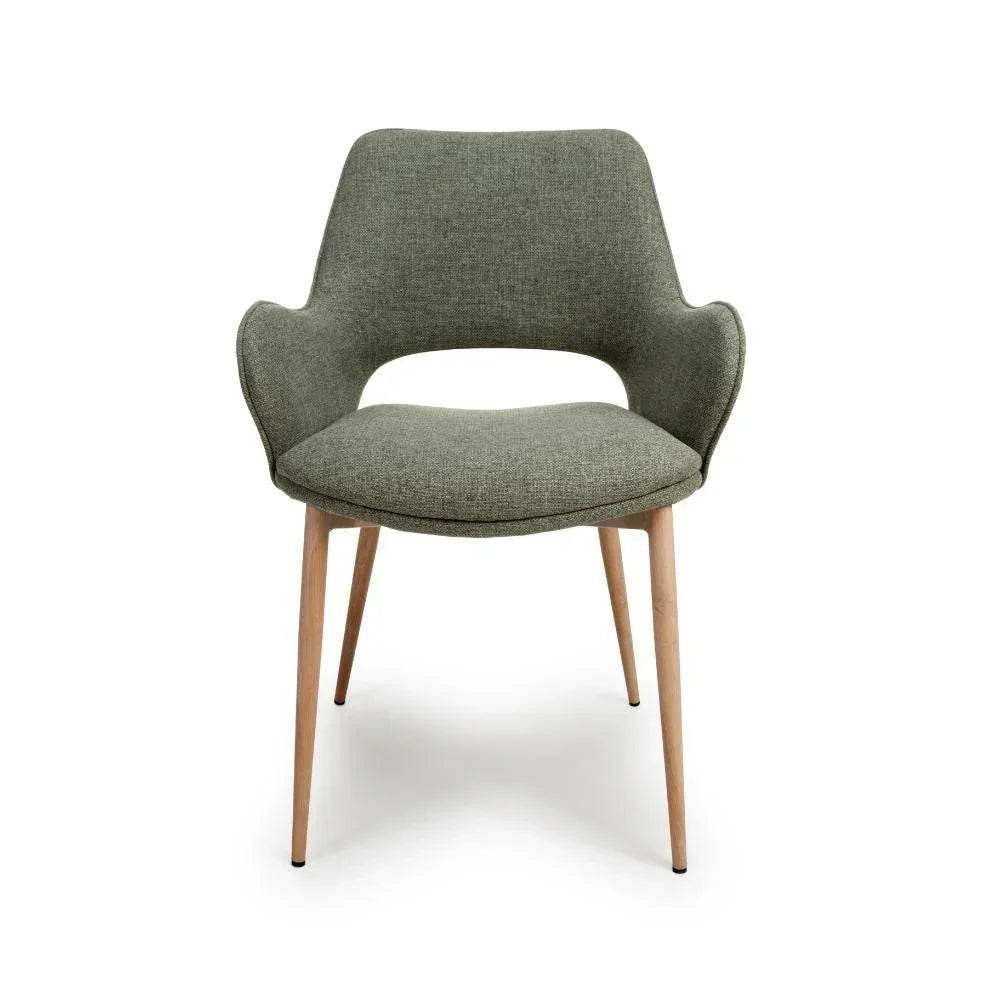 Green fabric dining chair with curved backrest and wooden legs, front view