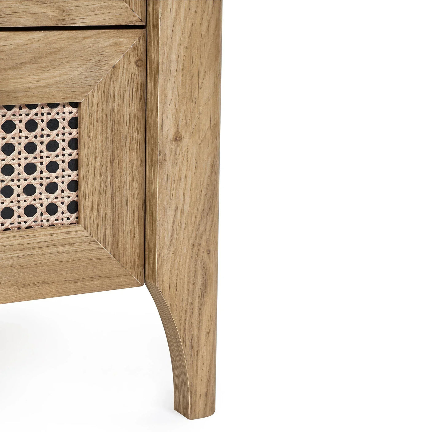 Close-up of rattan effect bedside table corner with oak wood finish and woven drawer detail