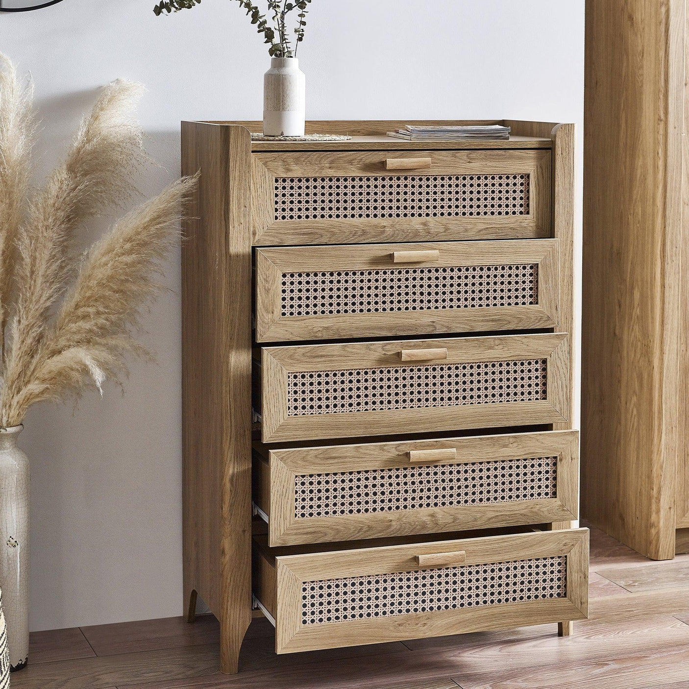 Sydney rattan effect 5 drawer chest in wood finish with woven drawer fronts in modern room