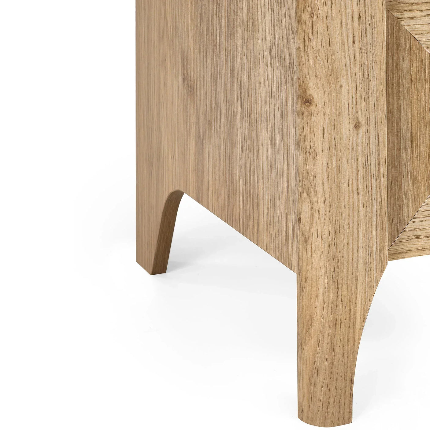 Side view of rattan effect drawer chest leg with natural wood grain finish
