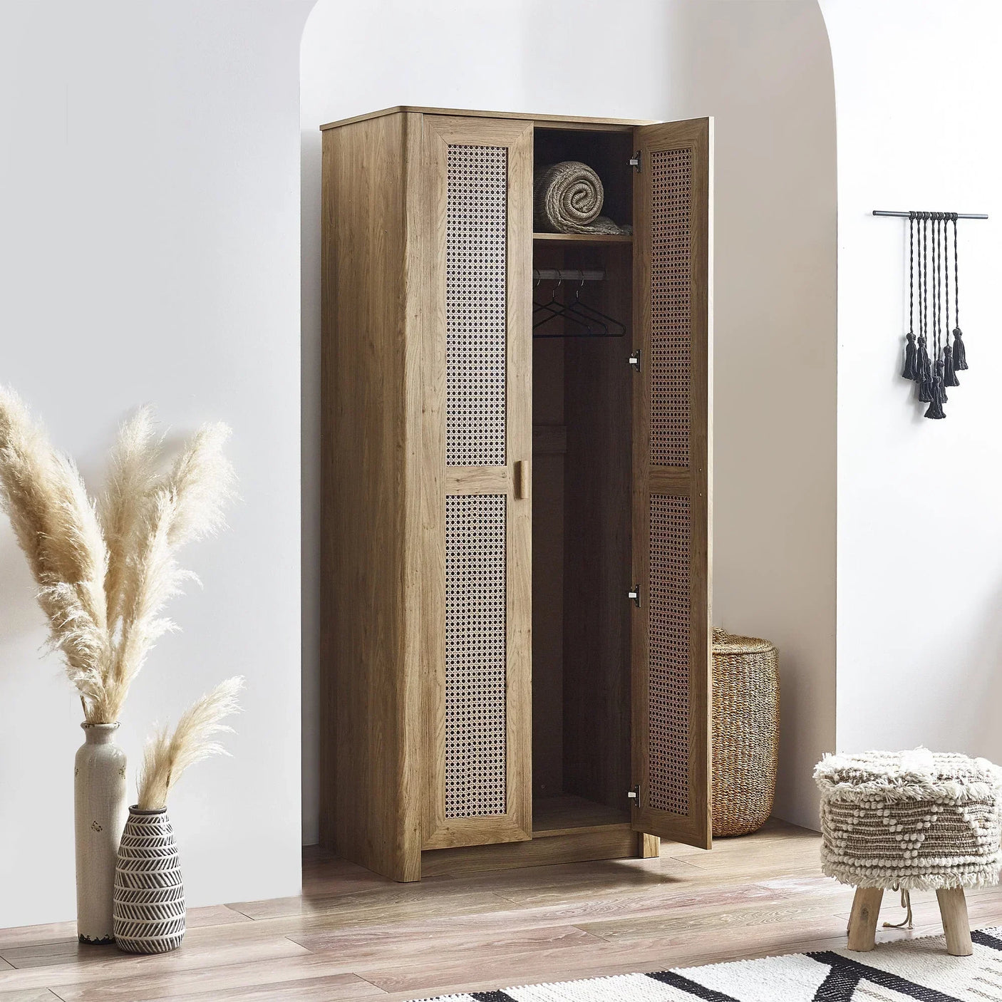 Sydney rattan effect wardrobe with open doors, natural finish, styled in modern room