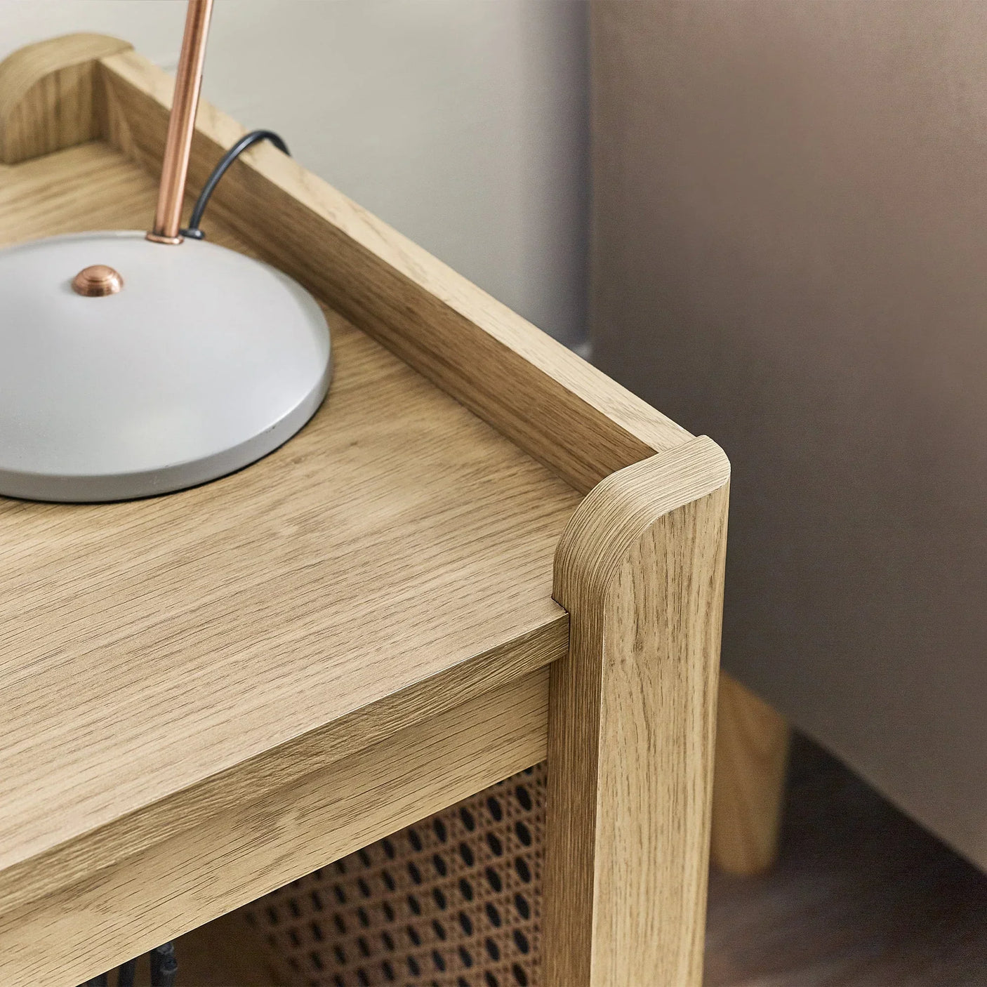 Sydney rattan effect lamp table with removable shelf in light wood, close-up corner view