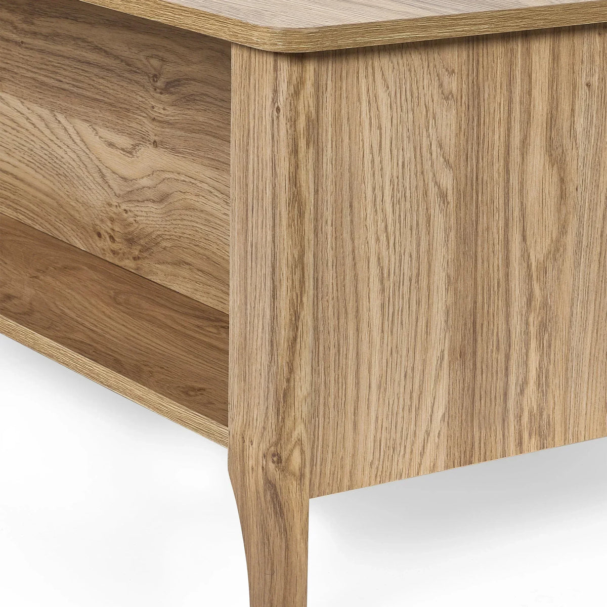 Close-up of rattan effect coffee table corner showing wood grain and drawer detail