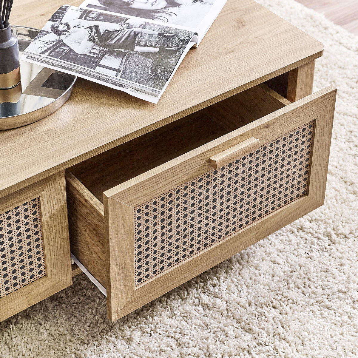 Rattan effect coffee table with open drawer, wood finish and patterned front panel detail