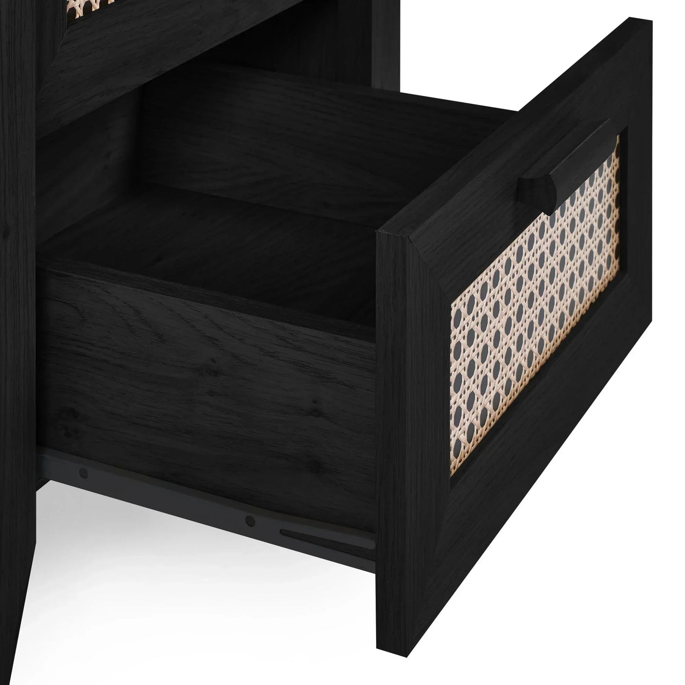 Open drawer of black rattan effect bedside table showing wood grain and cane detail