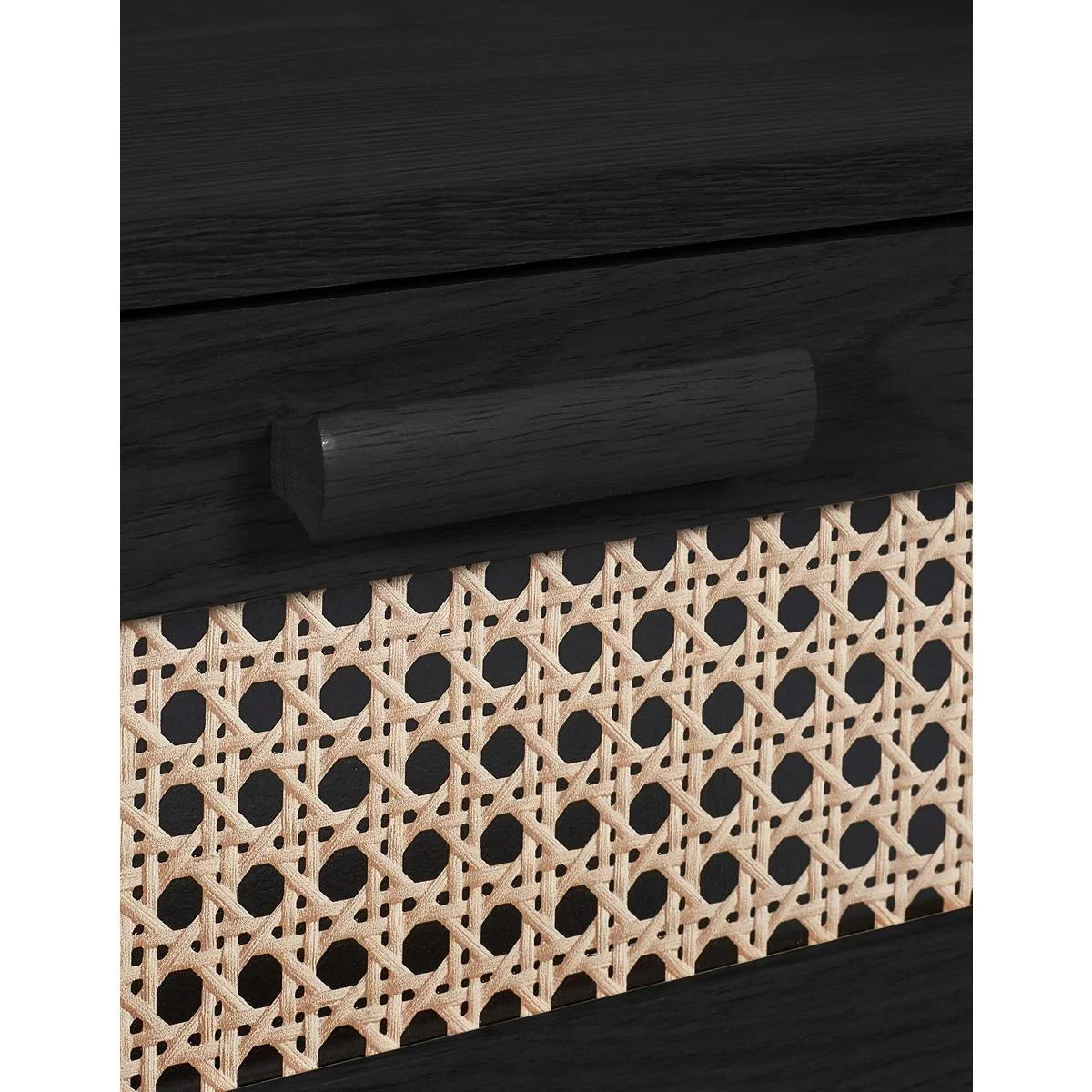 Black wood drawer with rattan panel and handle, closeup of furniture texture