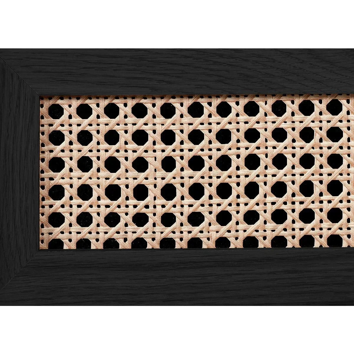 Closeup of cane panel with black wood frame, suitable for furniture or interior decor