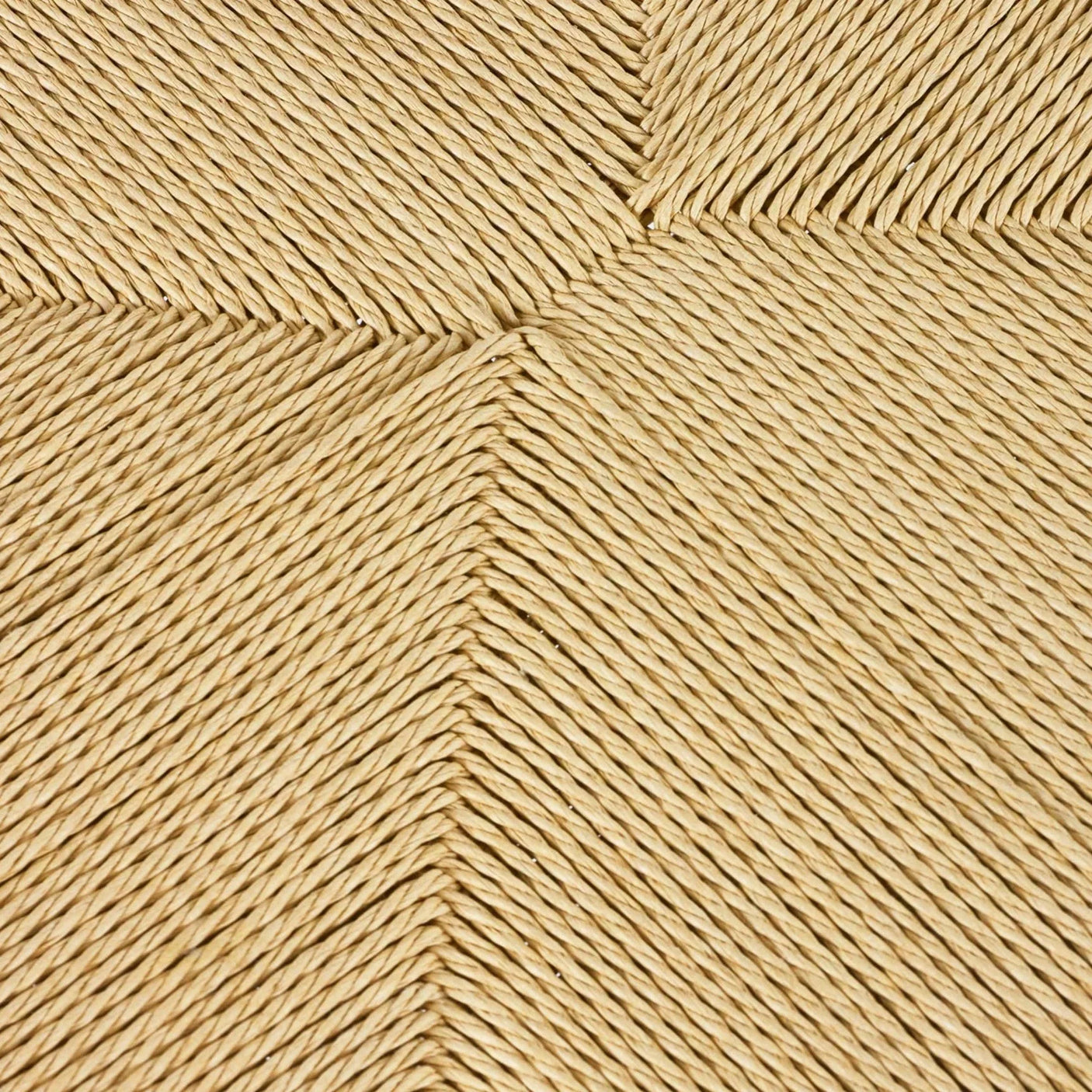 Closeup of natural woven rattan furniture seat texture in chevron pattern