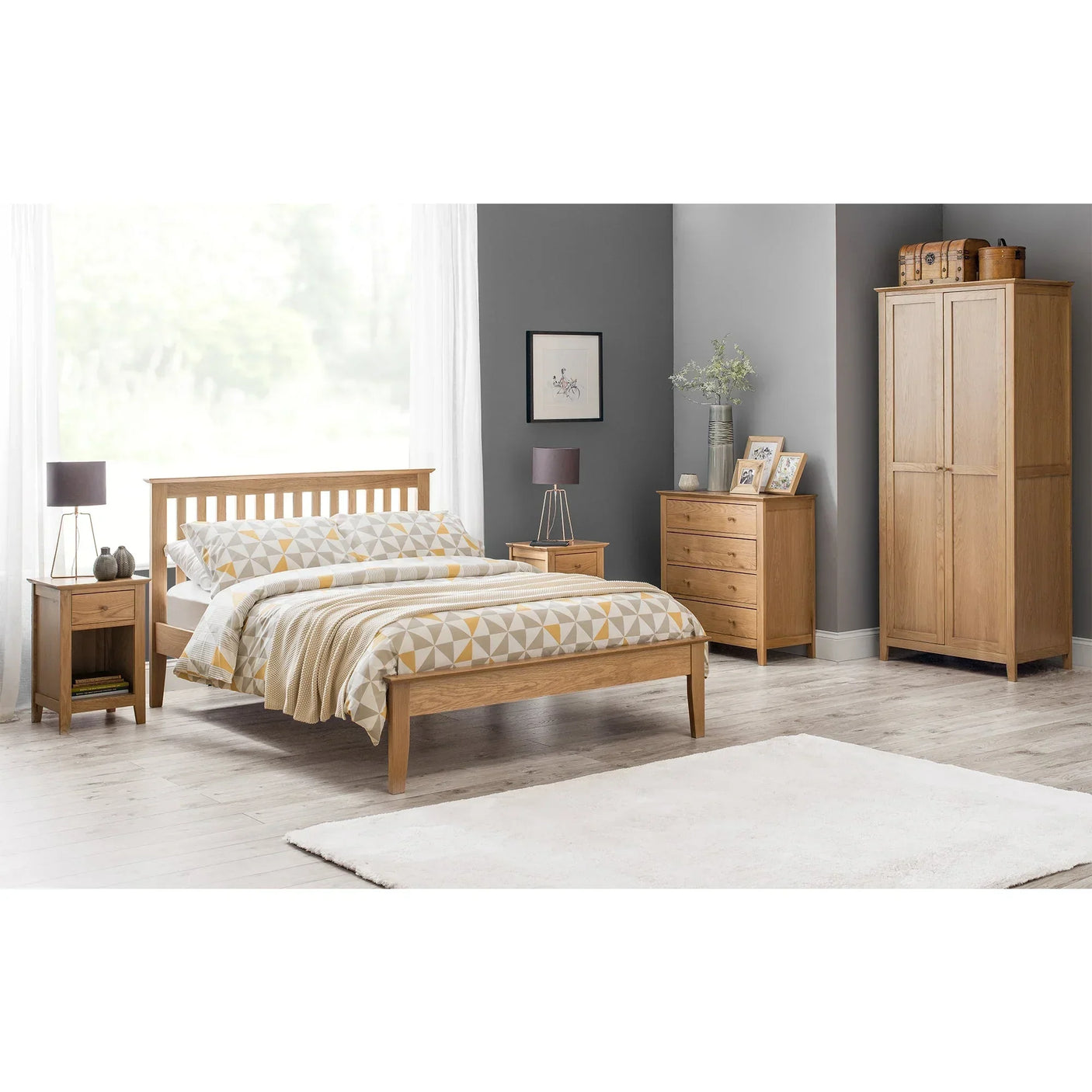 Oak bedroom furniture set with wooden bed, wardrobe, nightstands, and chest of drawers