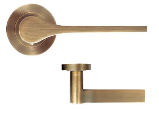 Brushed brass door handle with round rose, modern lever style shown from two angles