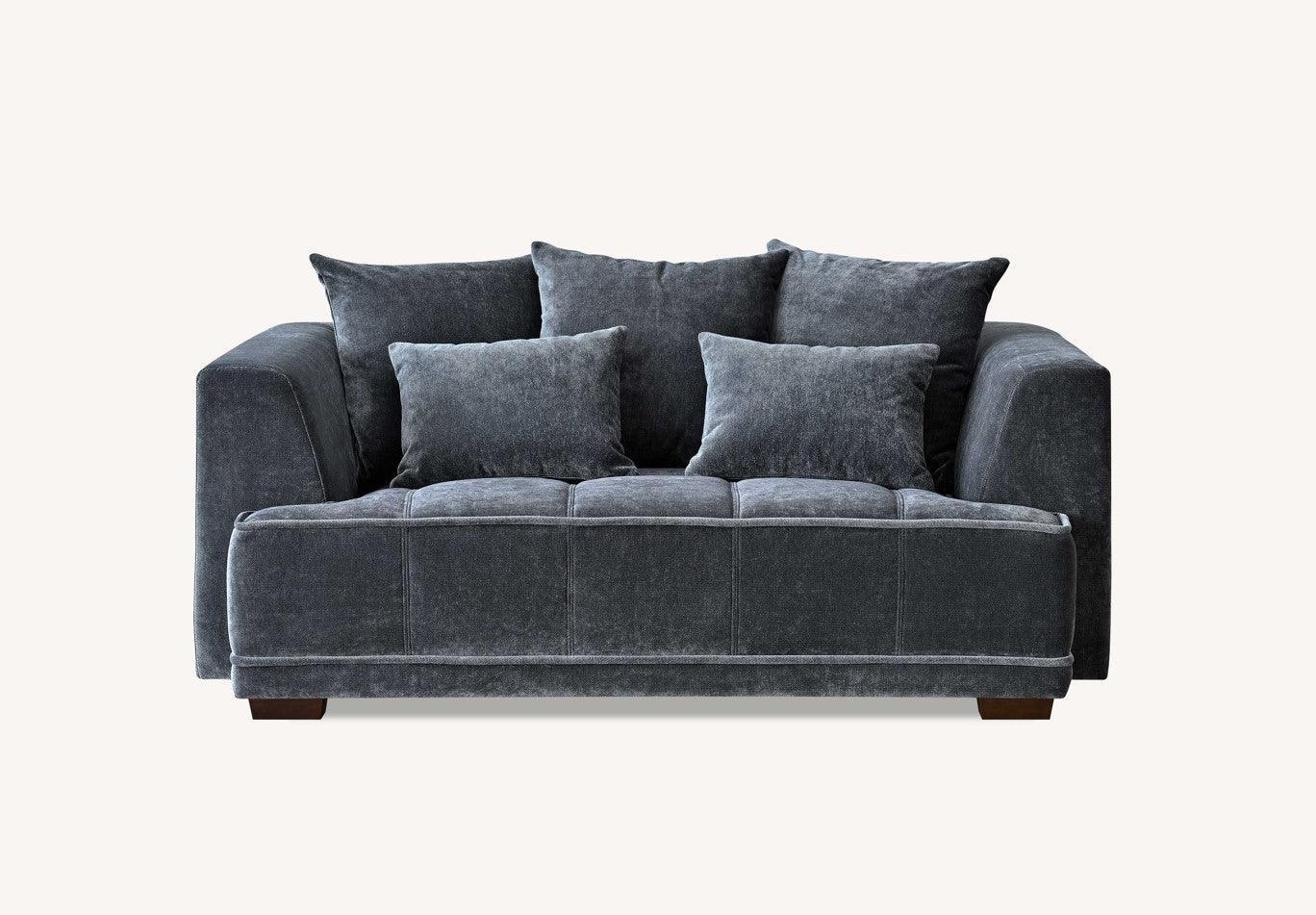 Charcoal velvet sofa with wide arms and plush back cushions, front angle view