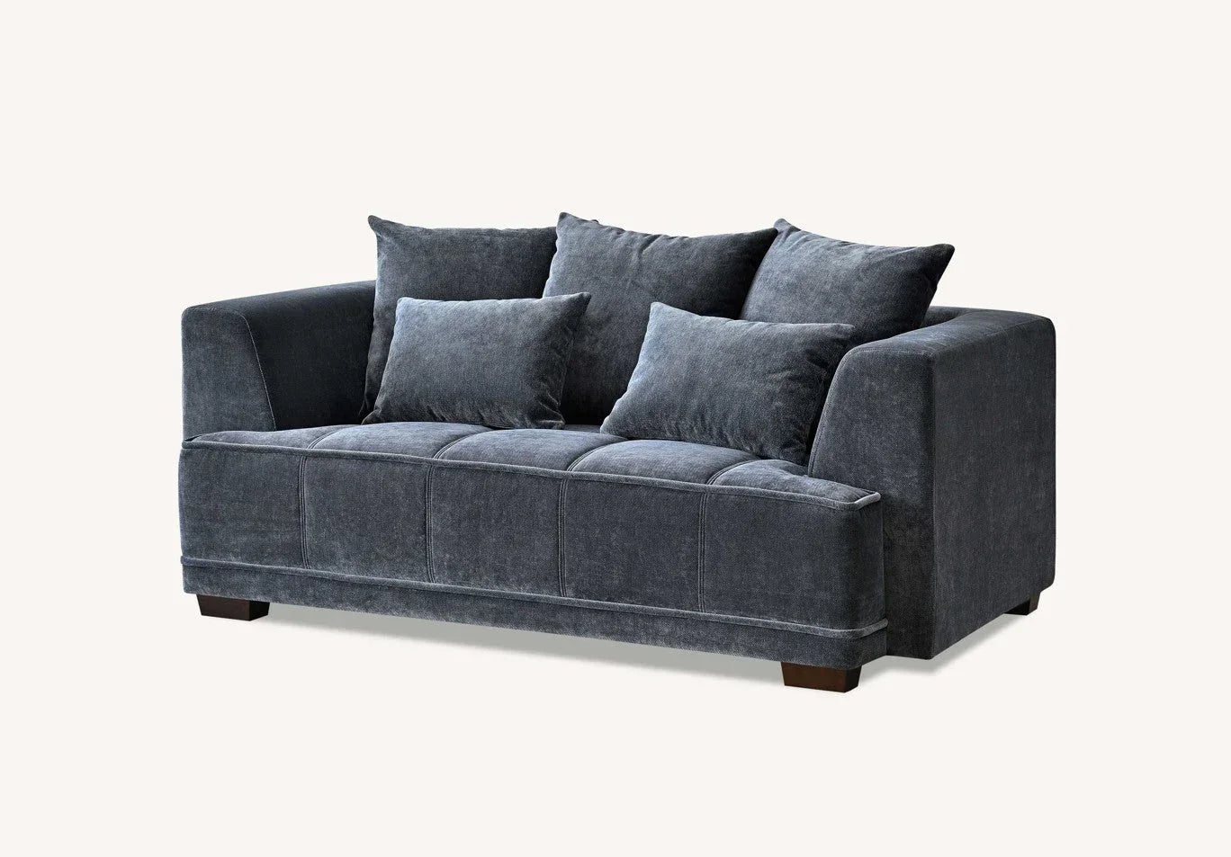 Dark grey fabric sofa with three seat cushions and four back cushions on wooden legs