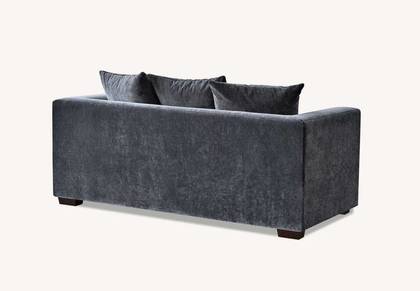 Charcoal fabric sofa with three back cushions and wooden feet, rear angle view