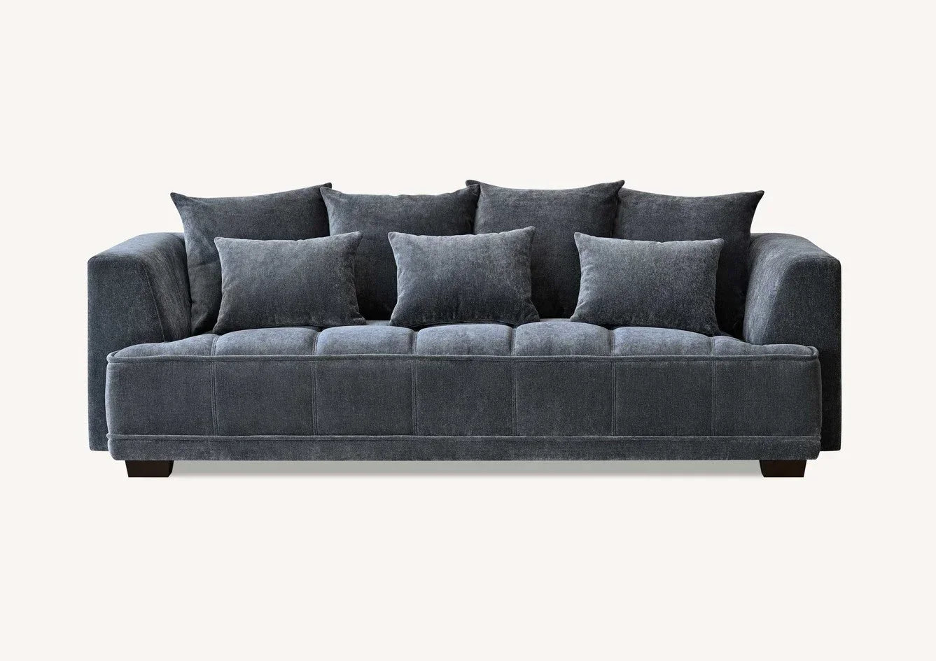 Grey fabric sofa with square arms, deep seat, and multiple matching scatter cushions