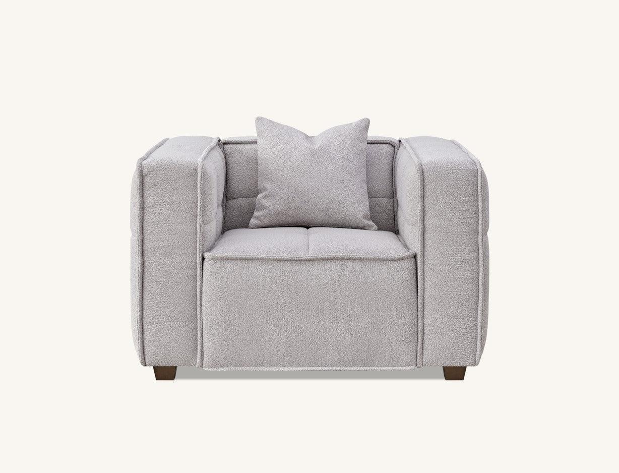 Light grey fabric armchair with square cushion and block arms, front view