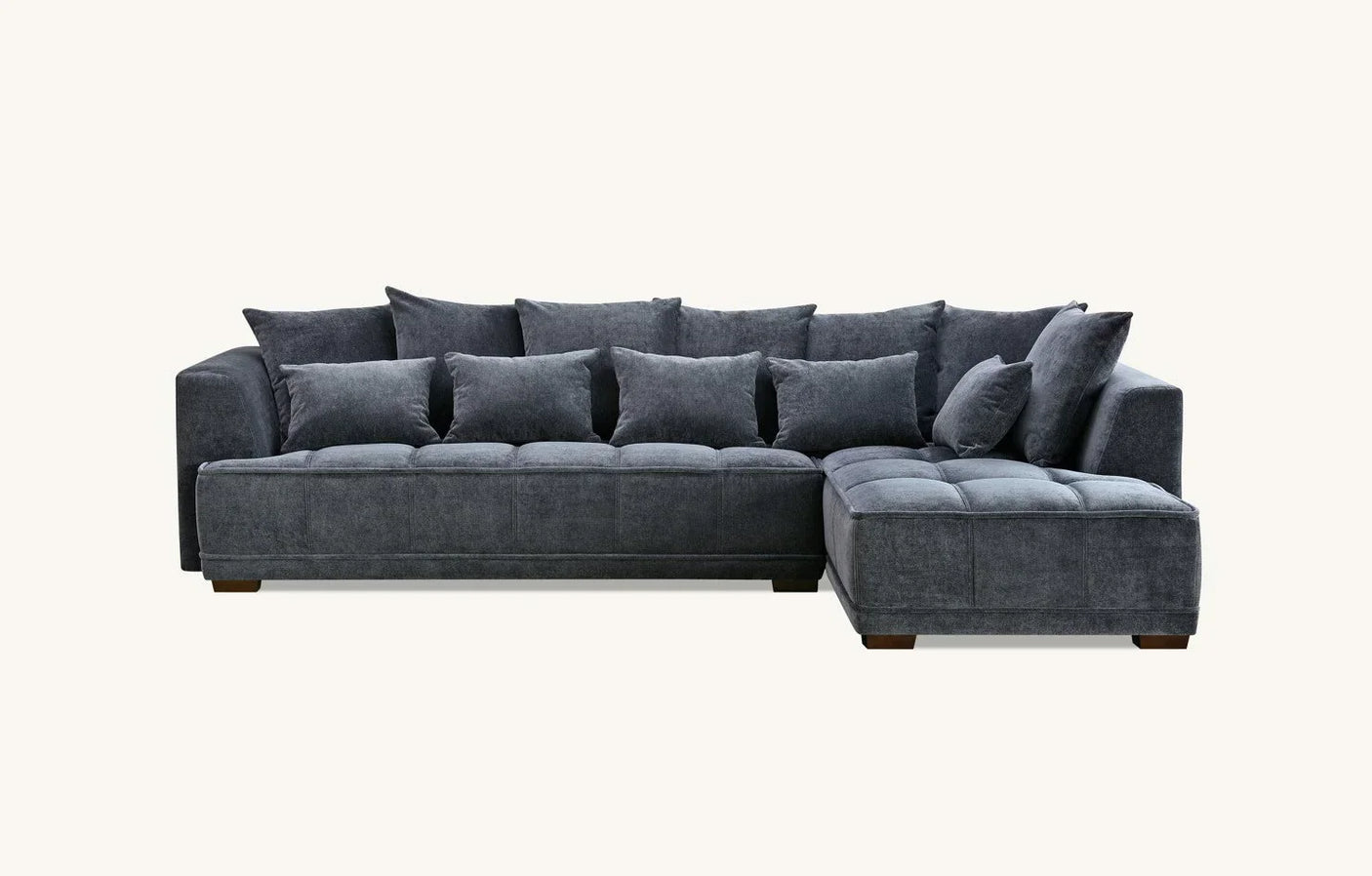 Dark grey corner sofa with plush cushions and fabric upholstery, right-hand chaise design