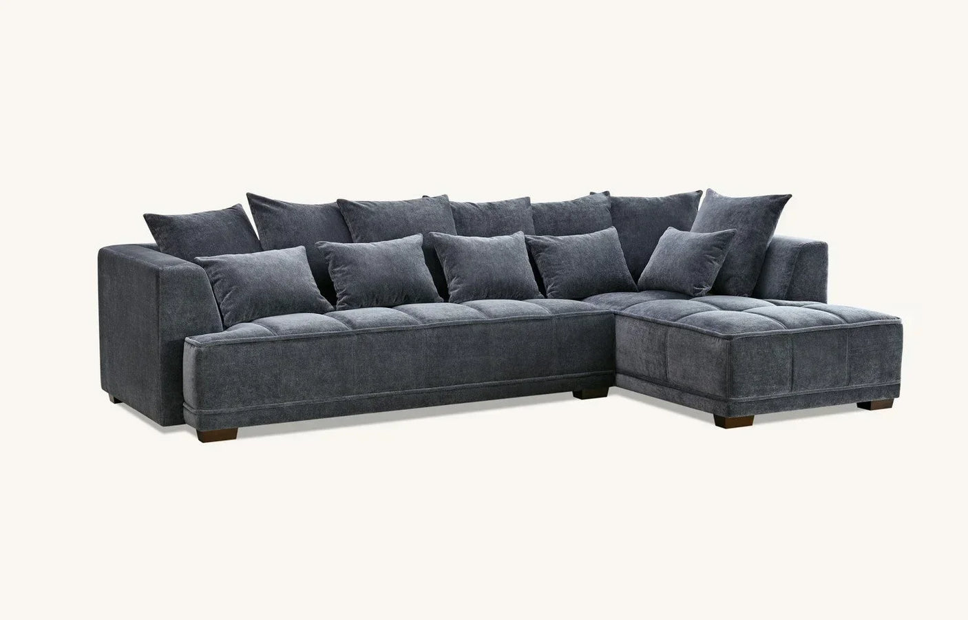 Charcoal grey corner sofa with chaise and plush scatter back cushions