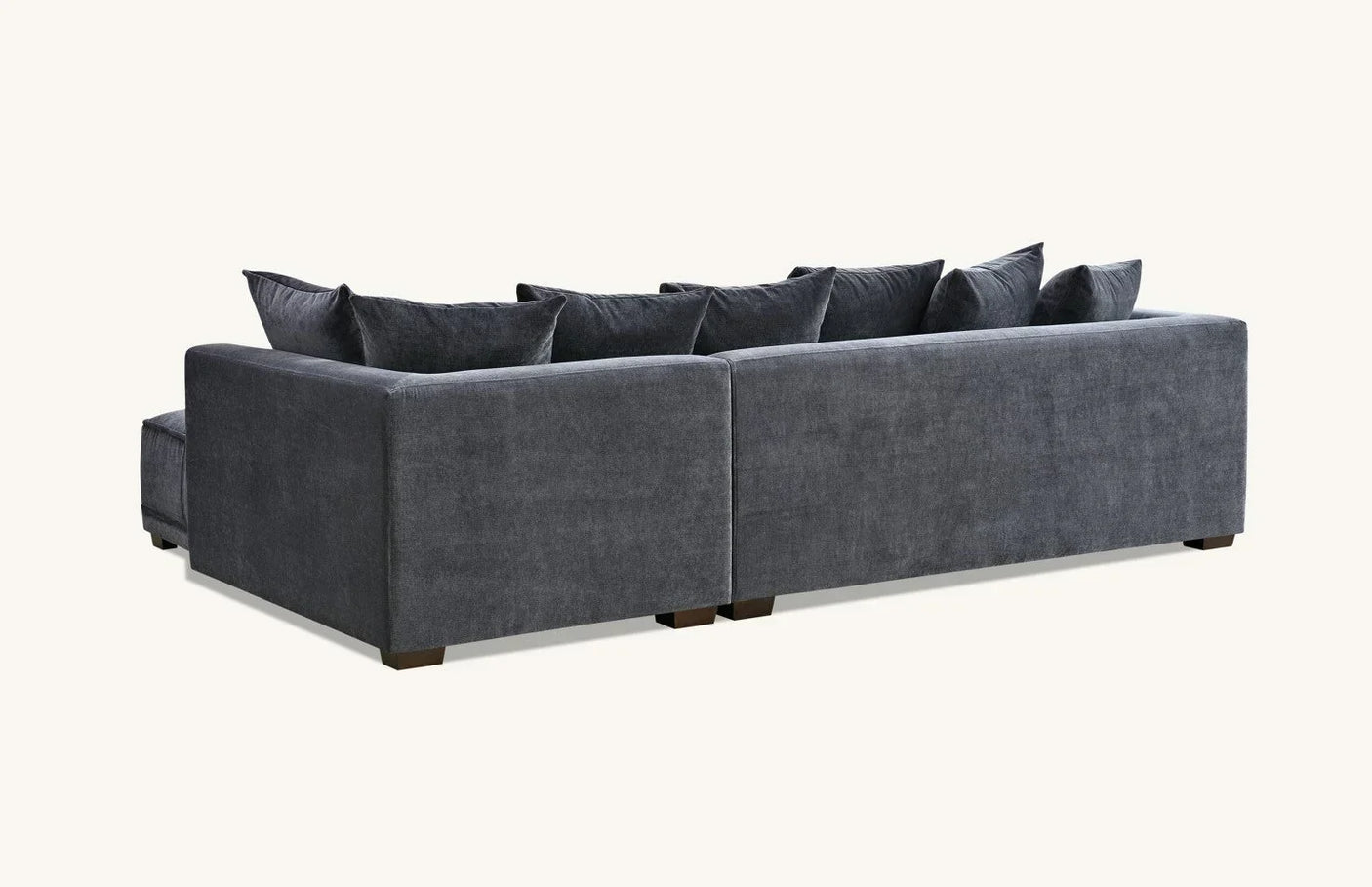 Charcoal fabric corner sofa with plush cushions, viewed from the back and side angle