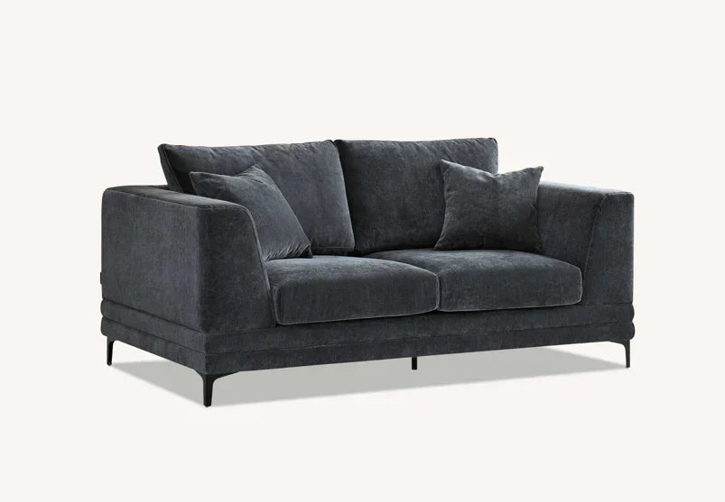 Dark grey fabric sofa with deep cushions and metal legs on light background