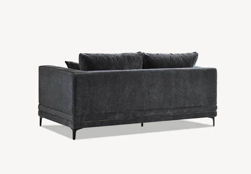 Charcoal fabric sofa with plush back cushions and slim black legs, rear angle view