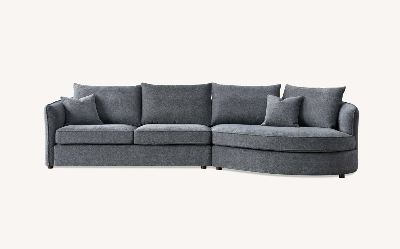 Dark grey fabric corner sofa with chaise lounge and scatter cushions