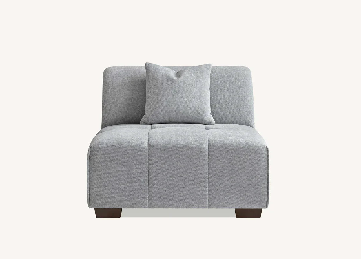 Light grey fabric armchair with matching cushion, viewed from the front