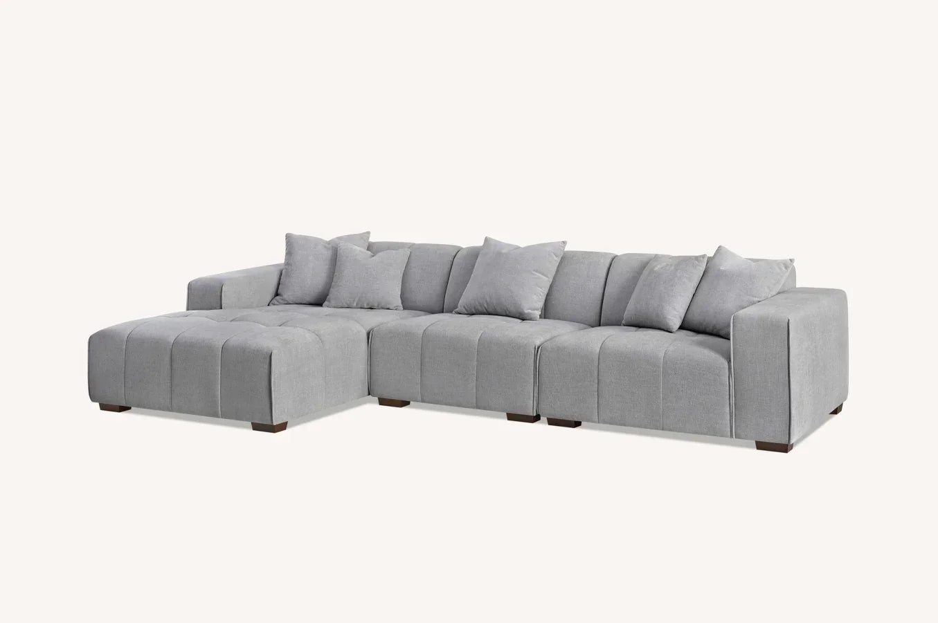 Grey fabric corner sofa with deep seats and matching scatter cushions