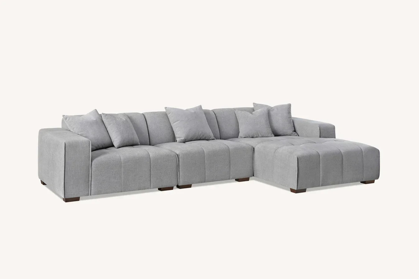 Modern grey fabric corner sofa with chaise and matching scatter cushions