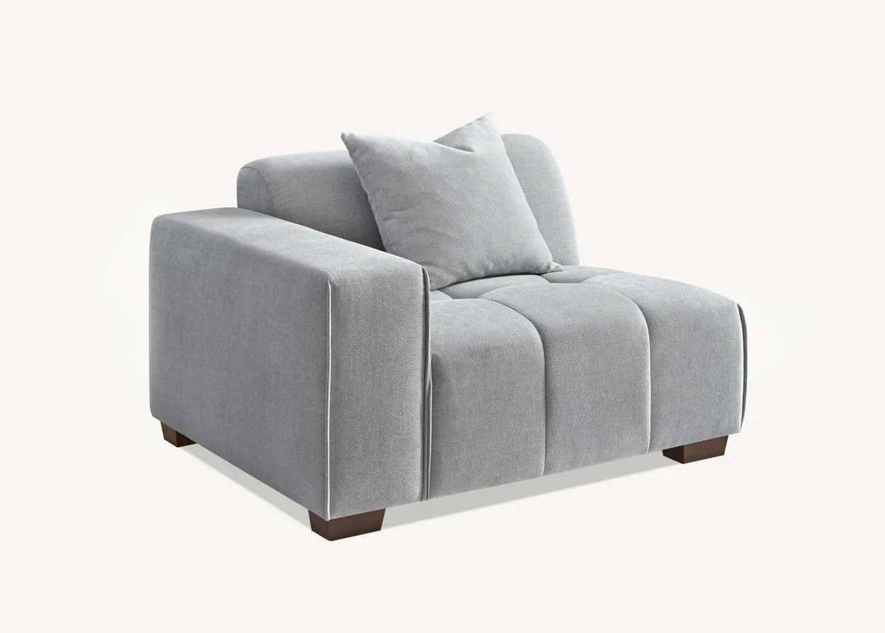 Grey fabric armchair with cushion and dark wood legs, modern design furniture