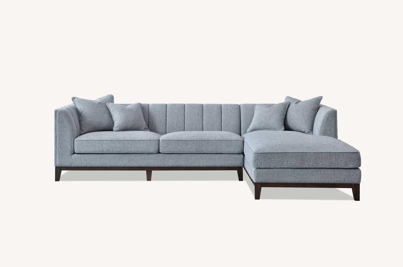 Grey fabric corner sofa with chaise and cushion set on dark wood legs