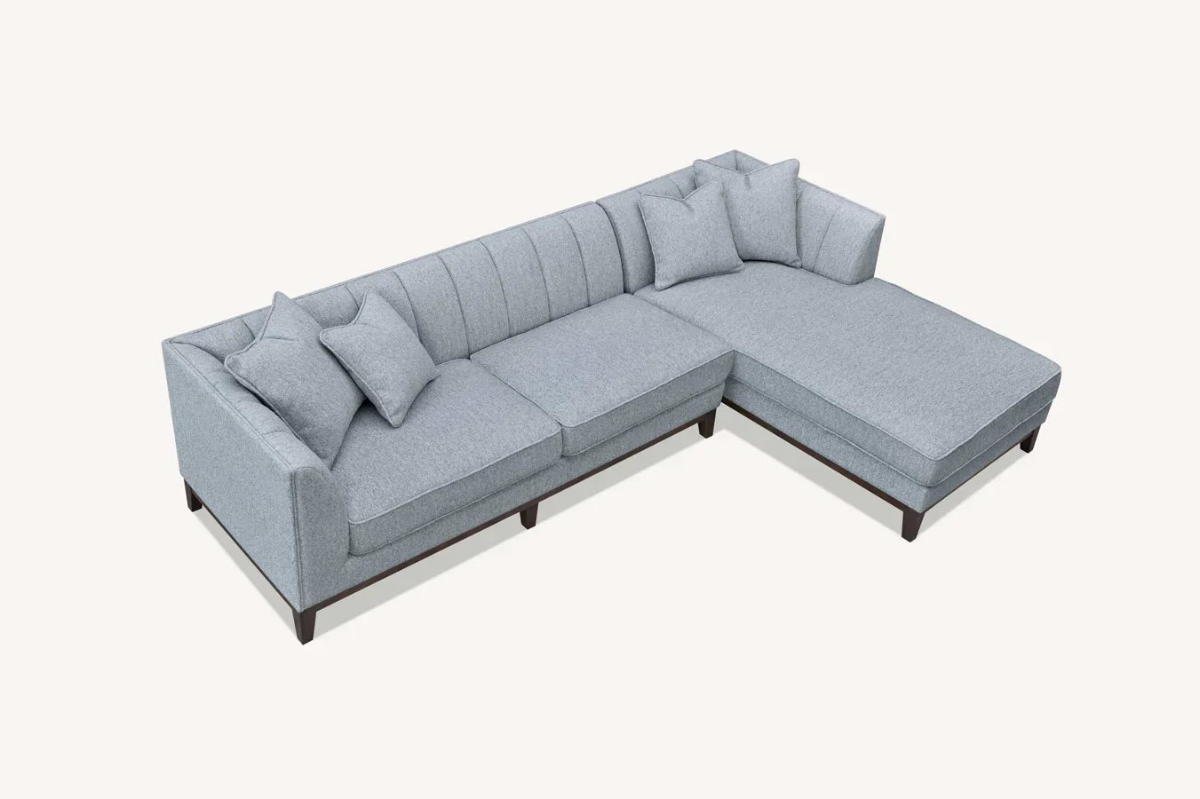 Light grey fabric corner sofa with chaise lounge and scatter cushions, wooden legs