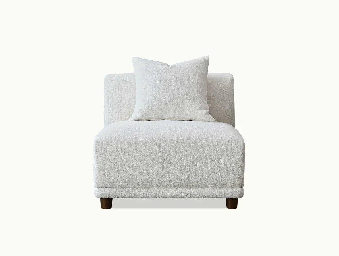 White fabric armless sofa chair with cushion and wooden legs, front view