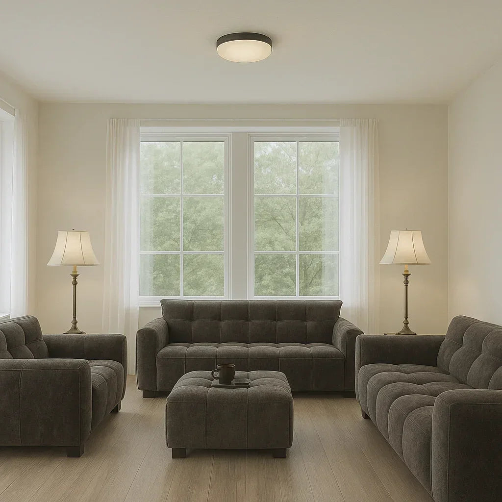 Velvet sofa set with ottoman in bright living room, wooden floor, large windows, floor lamps