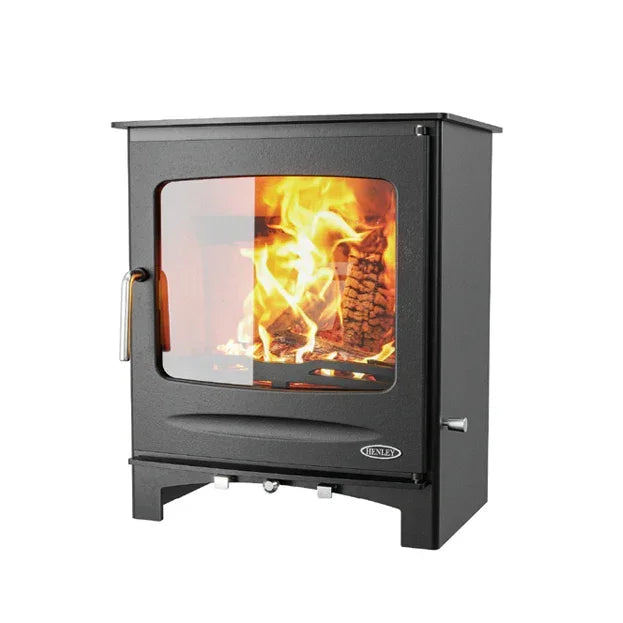 black wood burning boiler stove with large glass door and visible flames
